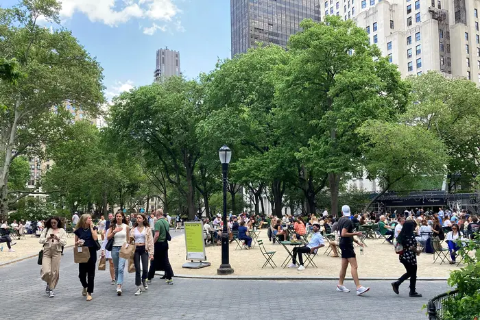 Madison Square Park with a bunch of people milling about